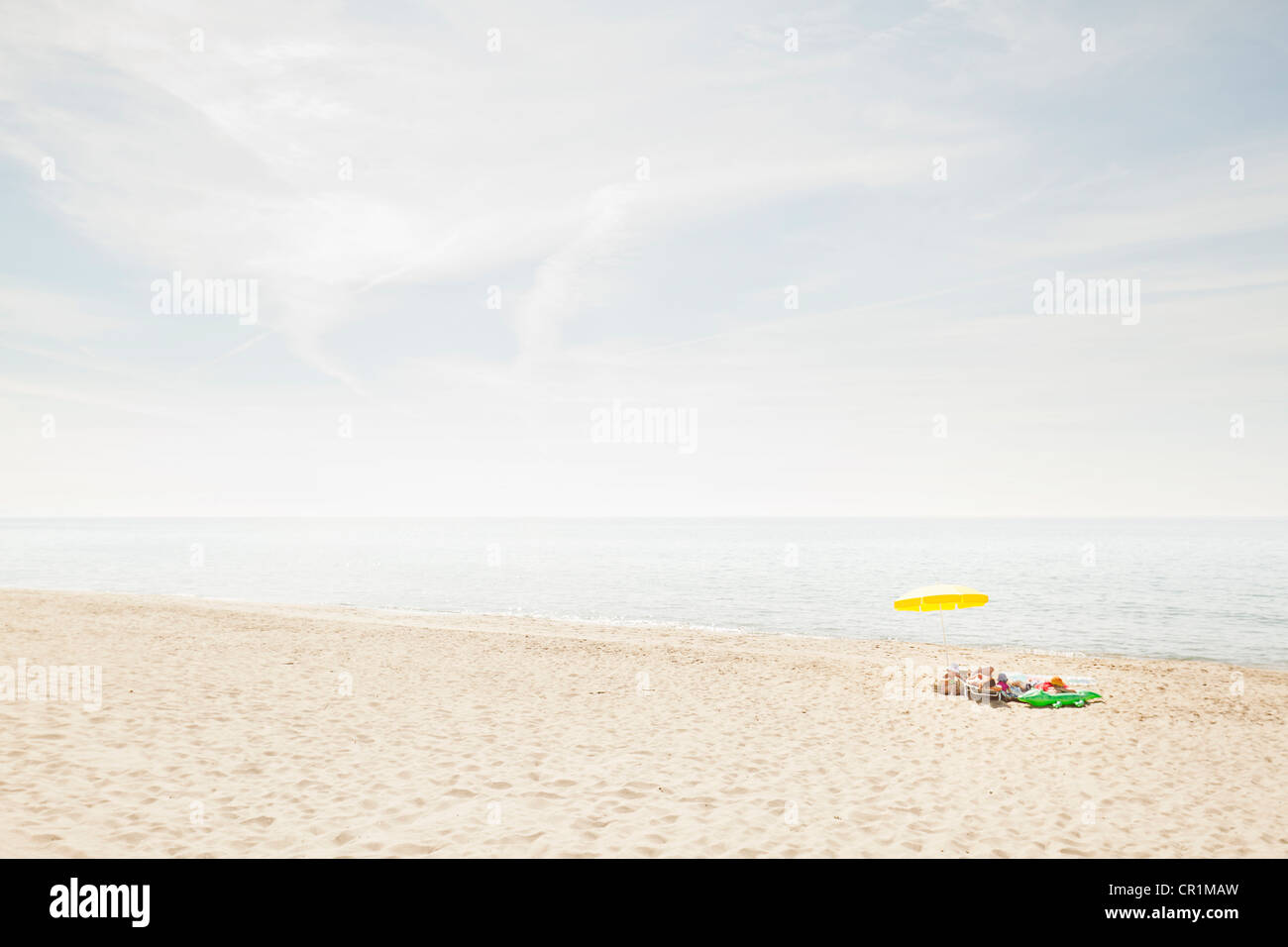 Umbrella and towels on beach Stock Photo Alamy