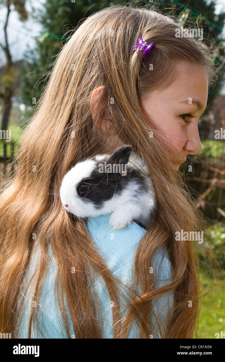 Girl, 10 years old, with a pet rabbit, Bavaria, Germany, Europe Stock Photo