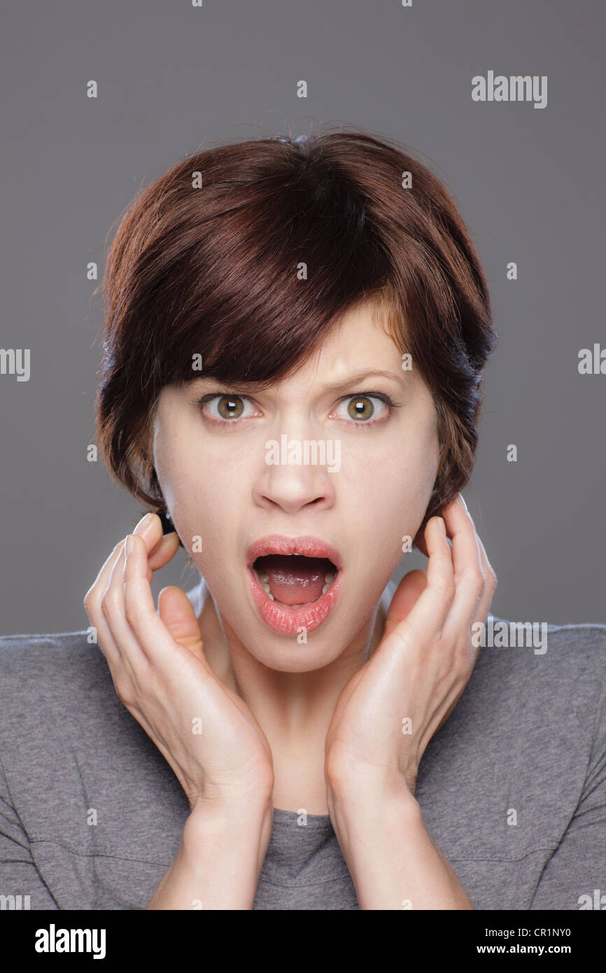 Vertical portrait shocked young hi-res stock photography and images - Alamy