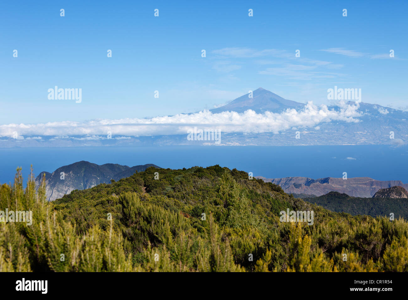 Garajonay National Park, view from Garajonay mountain, highest peak of La Gomera island, Tenerife island with Mount Teide at the Stock Photo