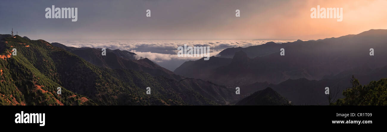 Panorama, sunrise with trade wind clouds from the fertile valley of Vallehermoso, La Gomera, Canary Islands, Spain, Europe Stock Photo