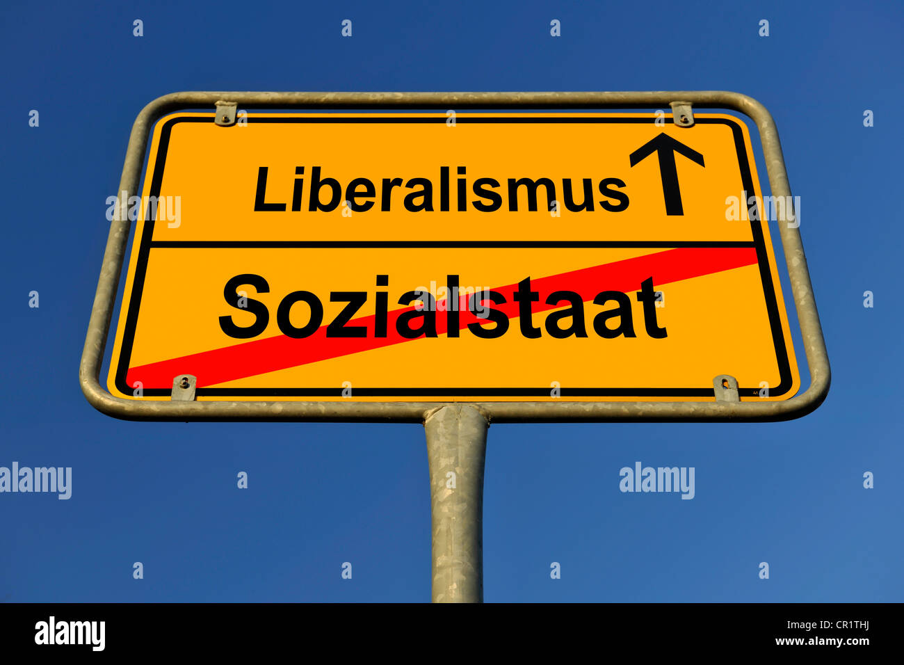 City limits sign with the words Liberalismus and Sozialstaat, German for liberalism and the welfare state, symbolic image for Stock Photo