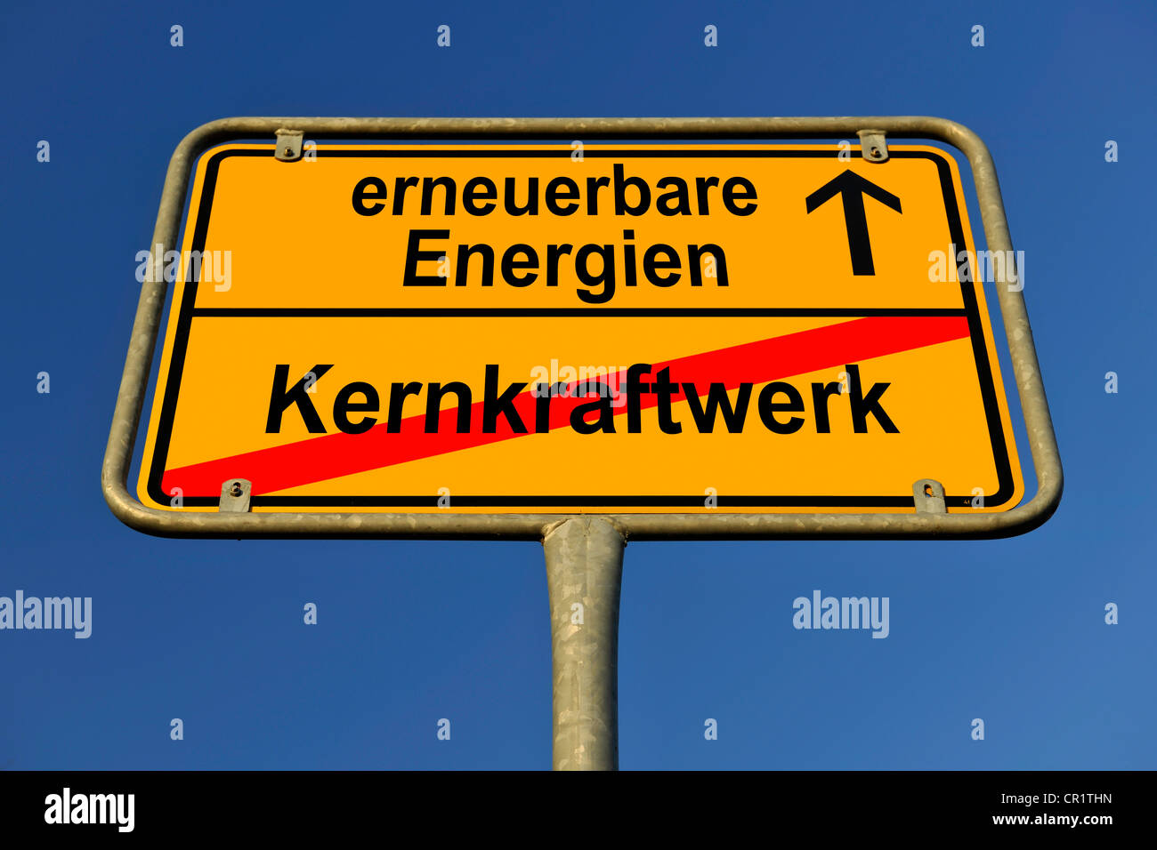 City limits sign with the words erneuerbare Energien and Kernkraftwerk, German for renewable energy and nuclear power station, Stock Photo
