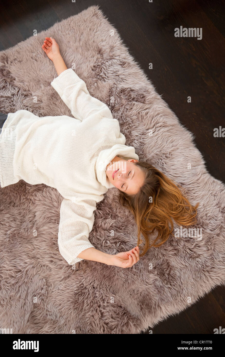 Woman lying on rug eyes closed hi-res stock photography and images - Alamy