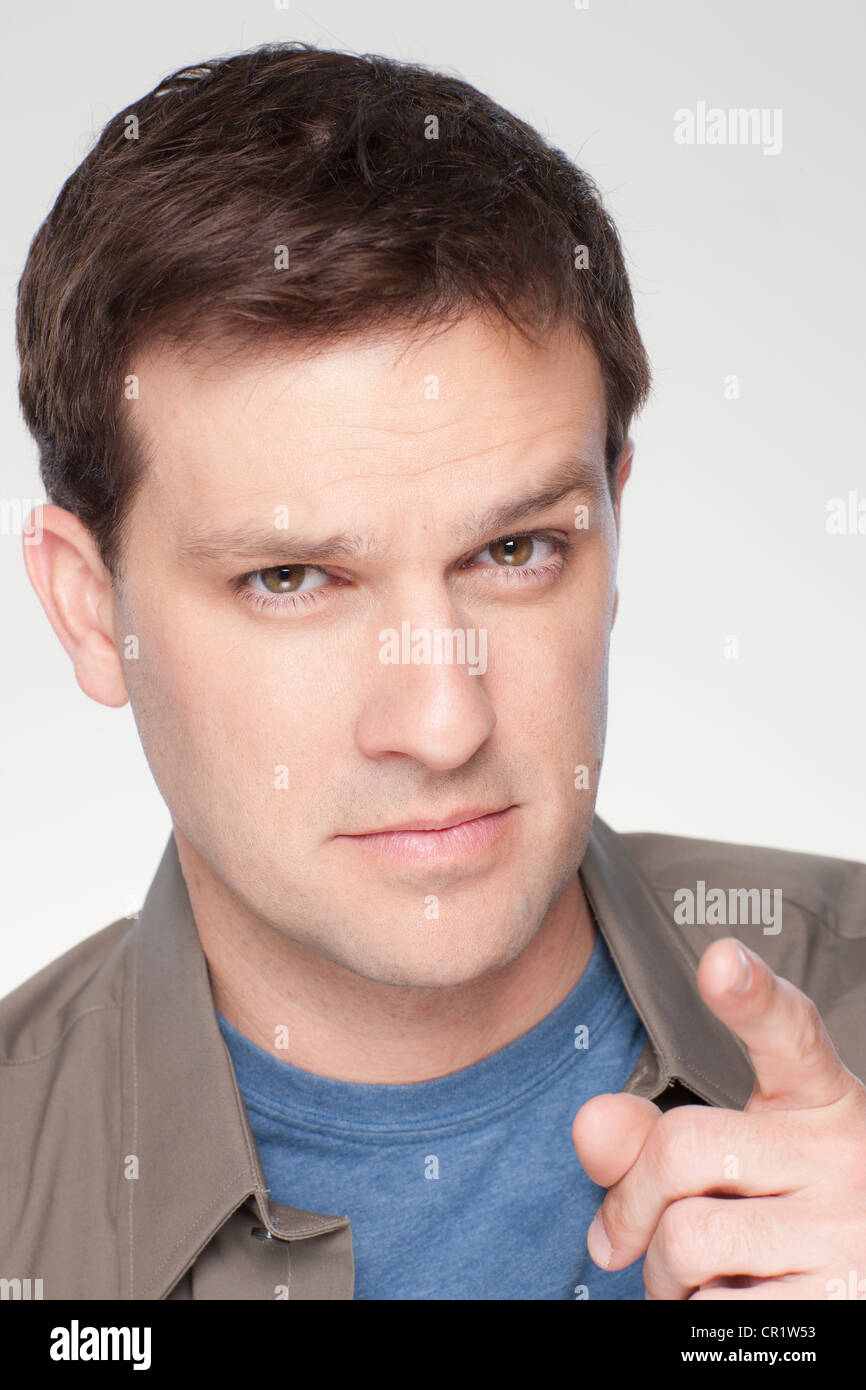 Pointing mid adult man hi-res stock photography and images - Alamy