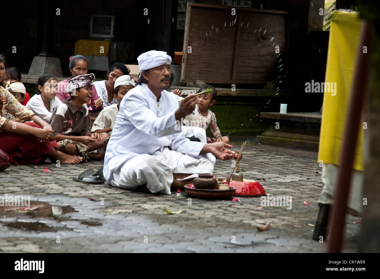 The priest throwing holy water Stock Photo Alamy