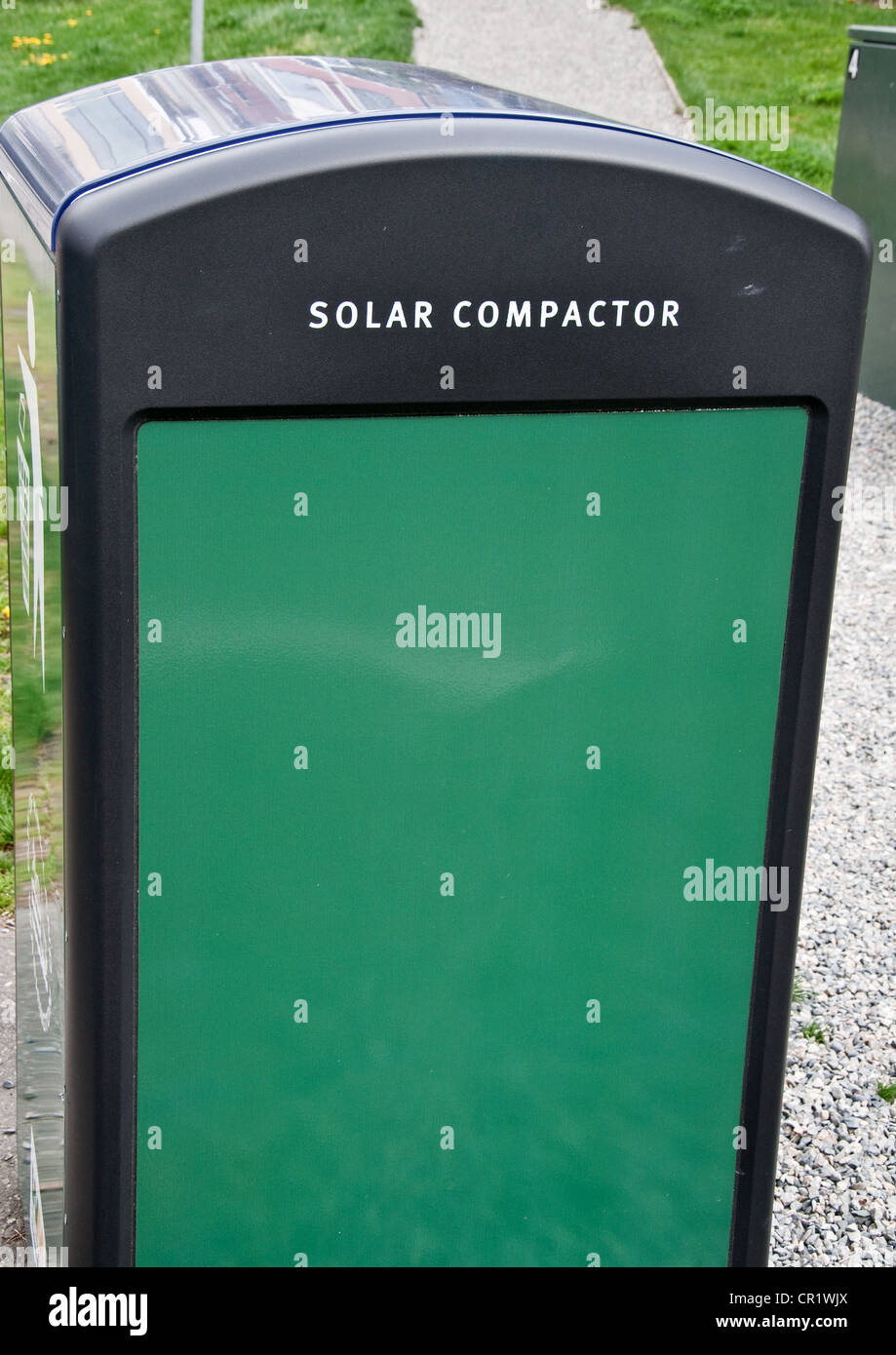 green solar compactor, a new technology for environmental concerns in the city. These use the sun's rays for reducing waste. Stock Photo