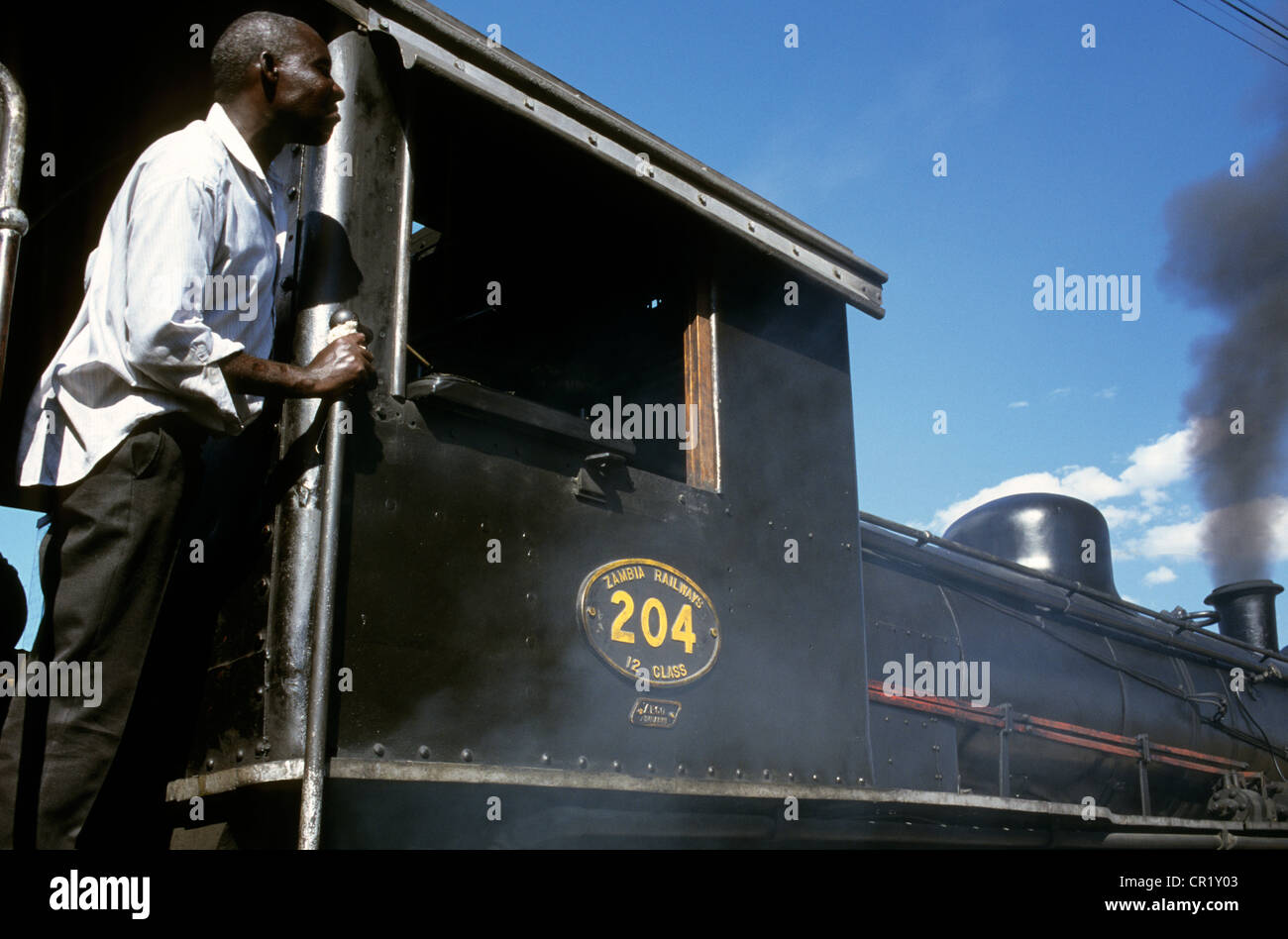 Zimbabwe. Victoria Falls. Steam train. Man looking out of window