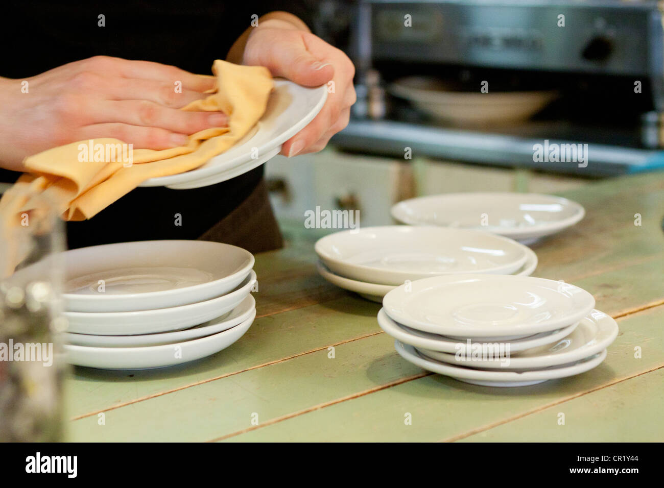 Hands drying dishes in kitchen Stock Photo Alamy