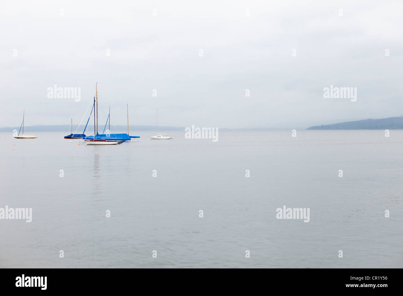Sailboats on still ocean Stock Photo