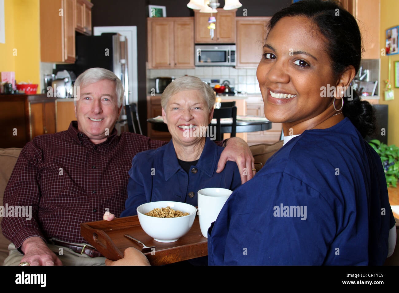 Home health care worker and an elderly couple Stock Photo - Alamy