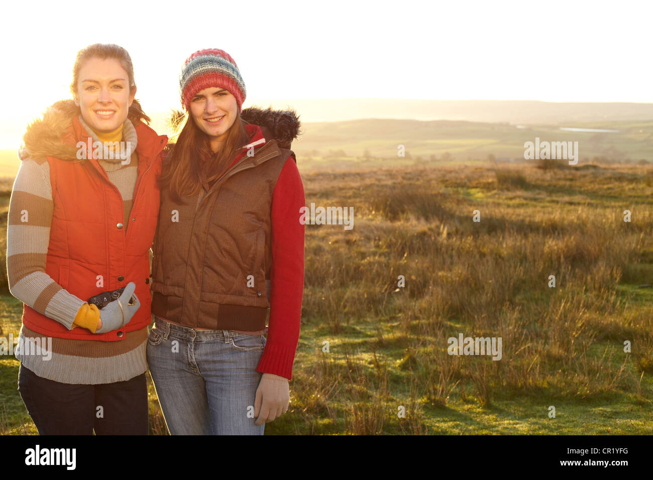 Women smiling together outdoors Stock Photo