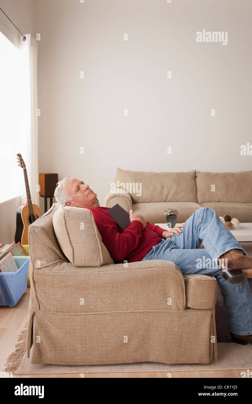 USA, California, Los Angeles, Senior man sleeping on armchair Stock ...