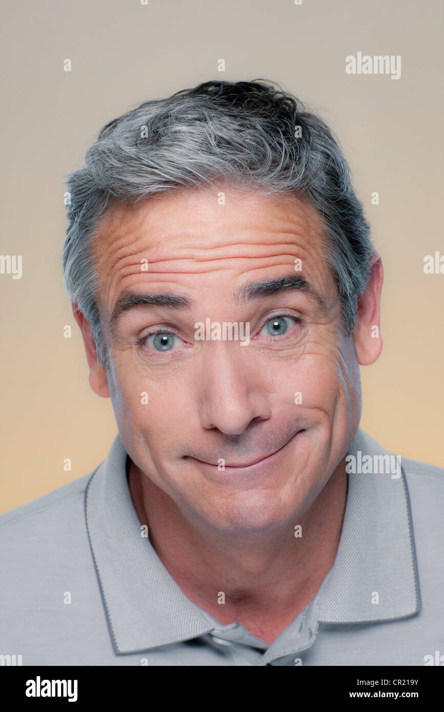 Studio Portrait of mature man smiling Stock Photo - Alamy