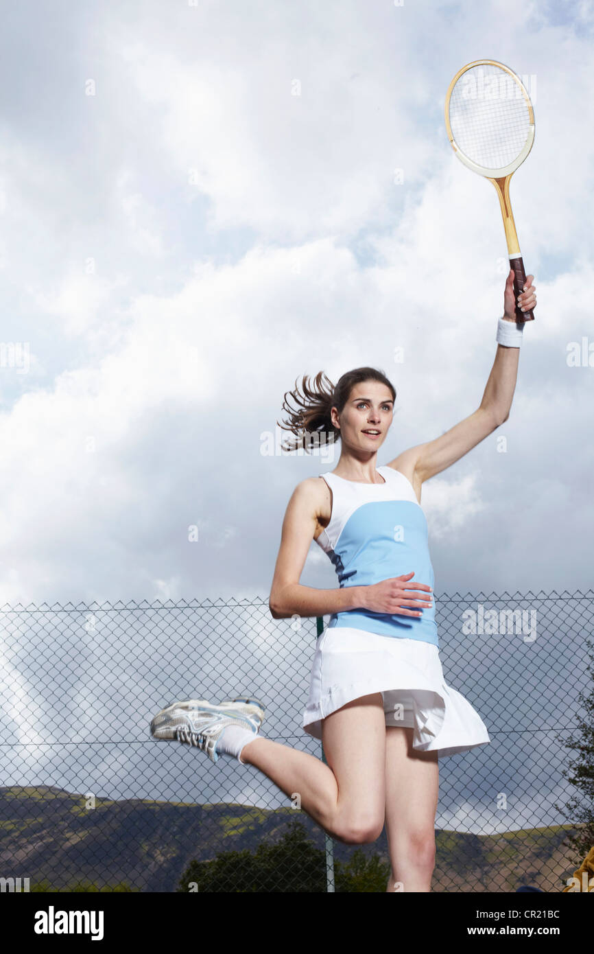 Woman Playing Tennis In Outdoor Court Stock Photo Alamy Woman Playing Tennis In Outdoor Court Stock Photo Alamy