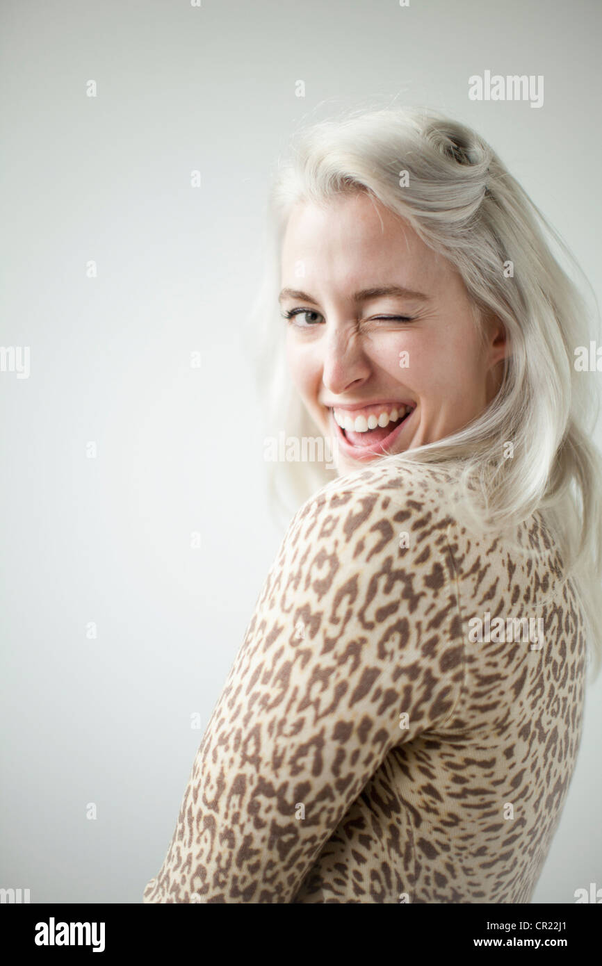 Young attractive woman blinking in front of camera Stock Photo