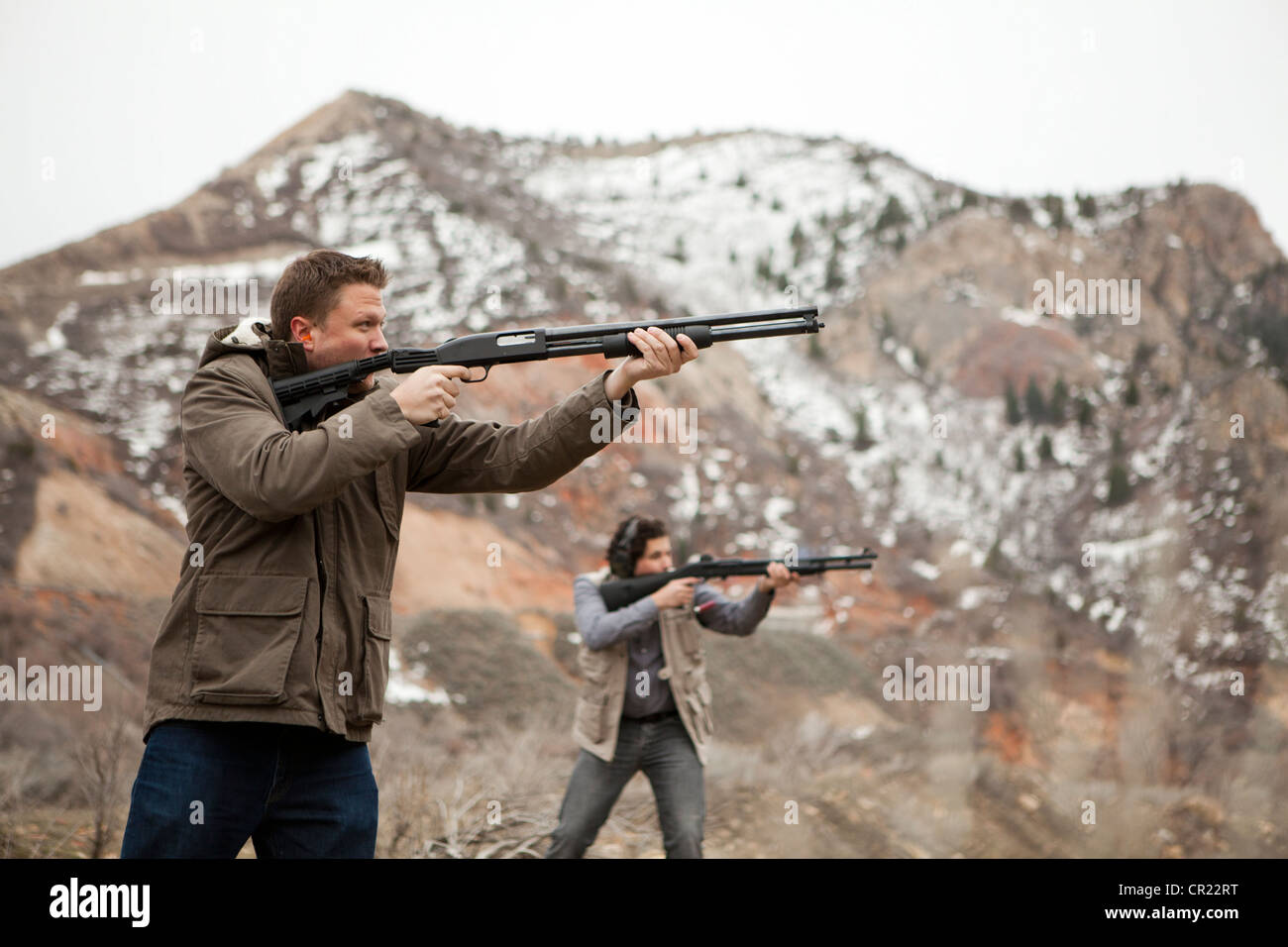 USA, Utah, Spanish Fork, Men in mountains shooting Stock Photo Alamy