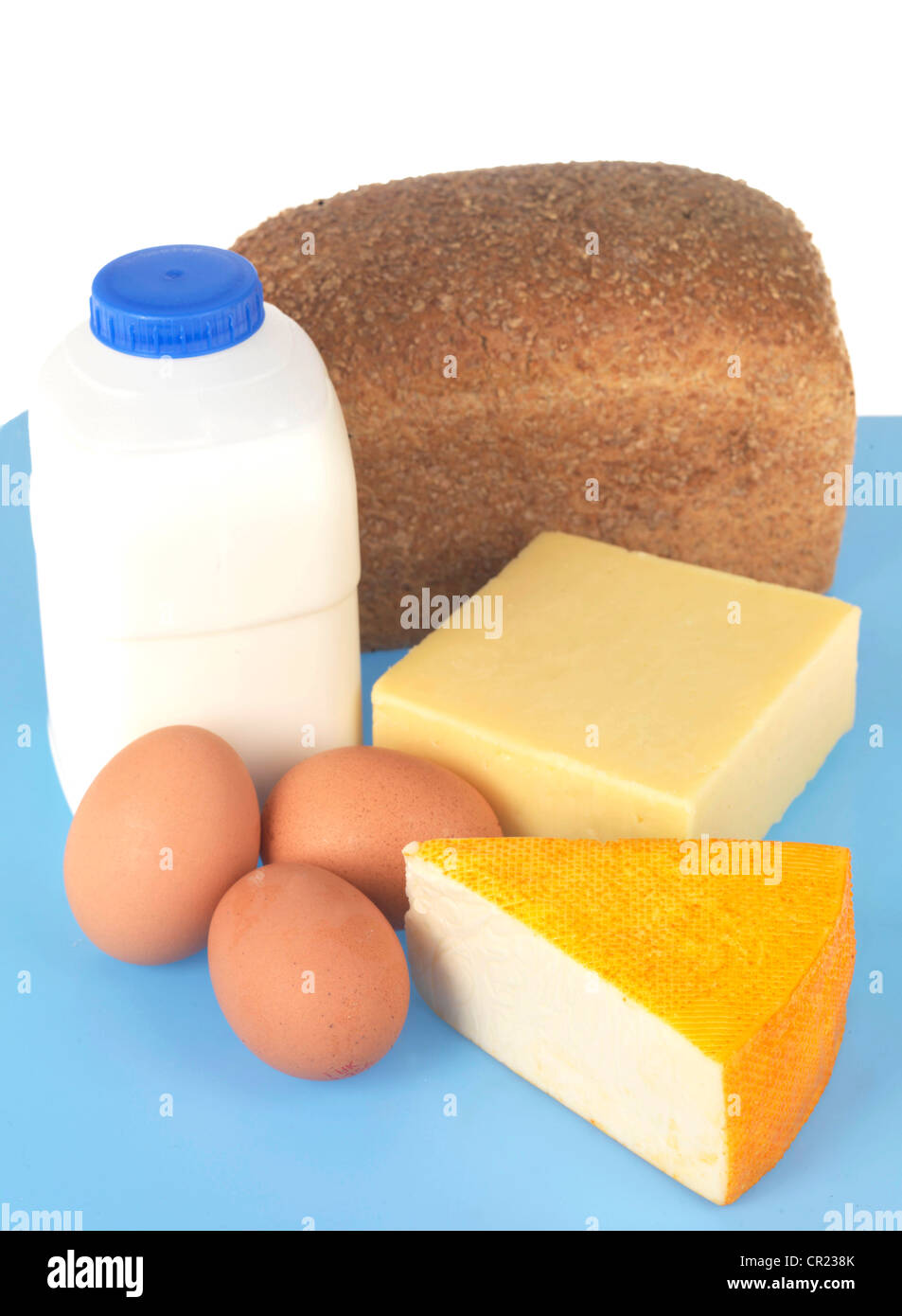 Food Staples of Milk Eggs Cheese and Bread Stock Photo Alamy