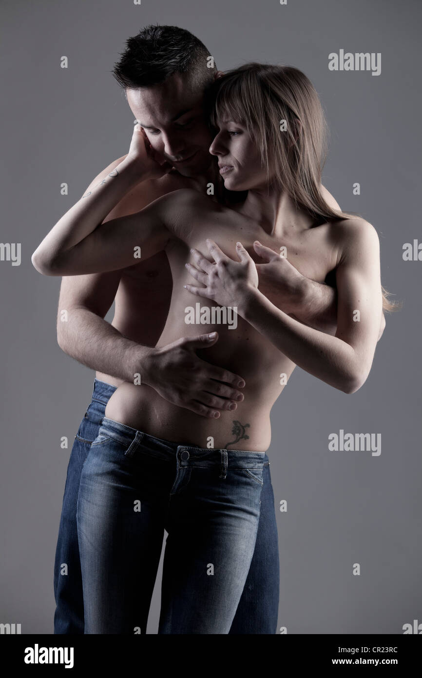 Nude couple hugging Stock Photo - Alamy