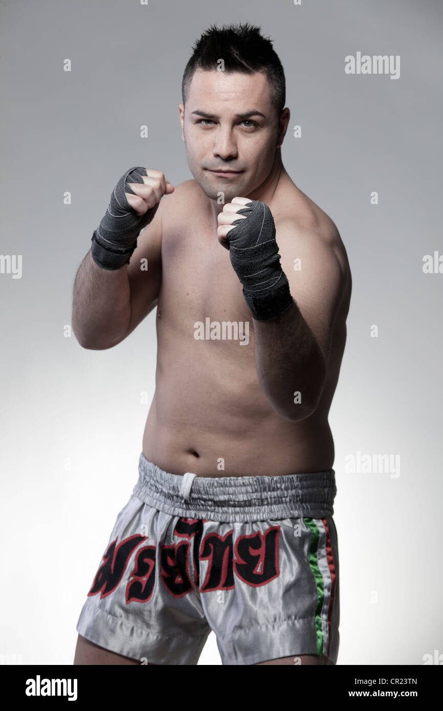 Boxer standing with fists raised Stock Photo