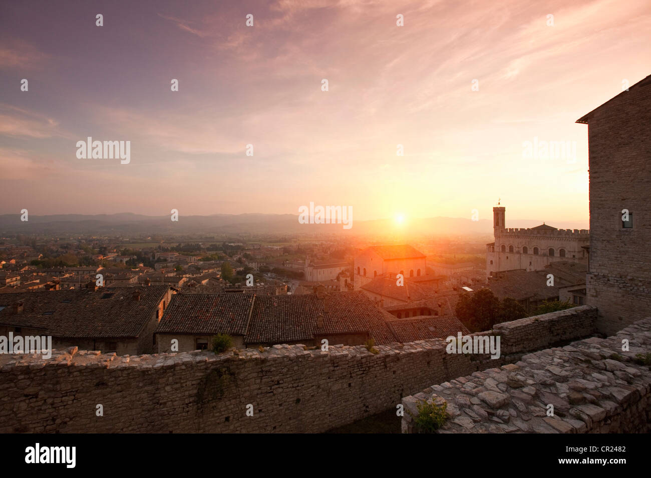 Sun shining over stone city walls Stock Photo