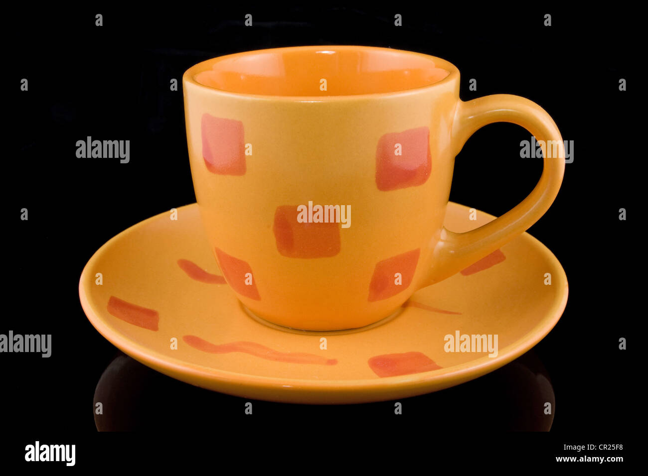 yellow coffee cup over a black background Stock Photo Alamy
