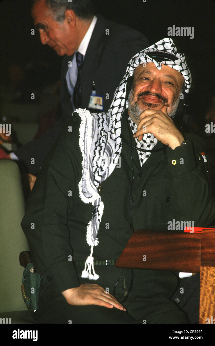 1987 -- palestinian president yasser arafat with gun in holster during the palestinian national council meeting in algiers Stock Photo