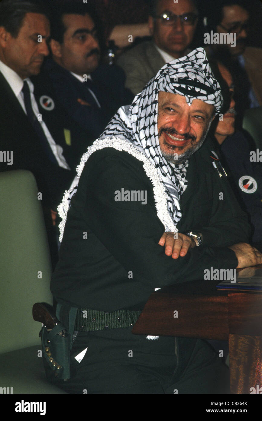 1987 -- palestinian president yasser arafat with gun in holster during the palestinian national council meeting in algiers Stock Photo