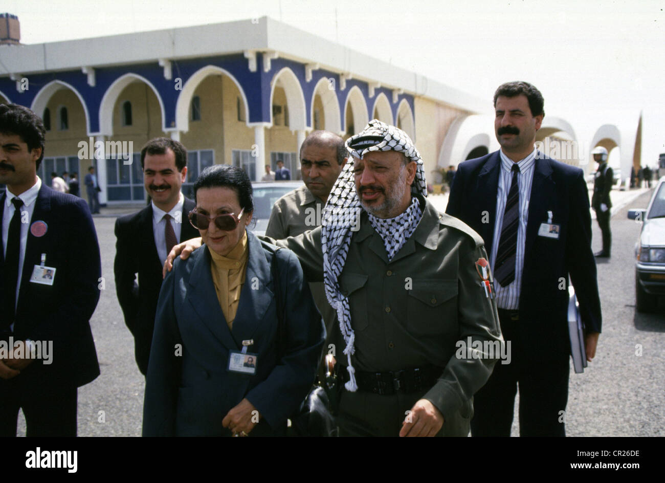 palestinian president yasser arafat walks with his sister during the  1987 palestinian national council meeting in algiers. Stock Photo