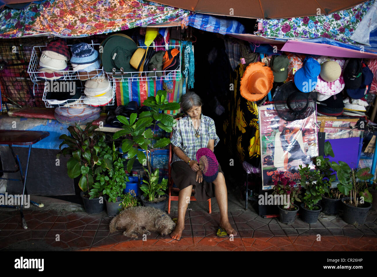 Local woman sleeps near Khao San Road, Bangkok, Thailand. Stock Photo