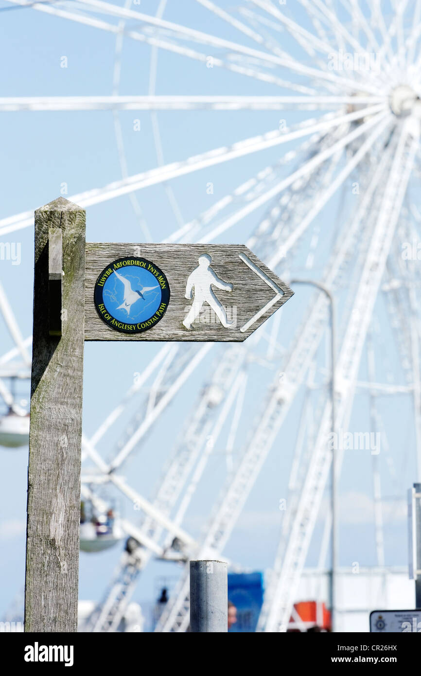 An Anglesey Coastal Path signpost in the seaside resort town of Beaumaris. Stock Photo