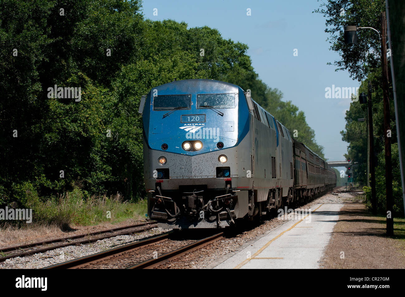 Amtrak railroad passenger train approaching DeLand rail Station Florida
