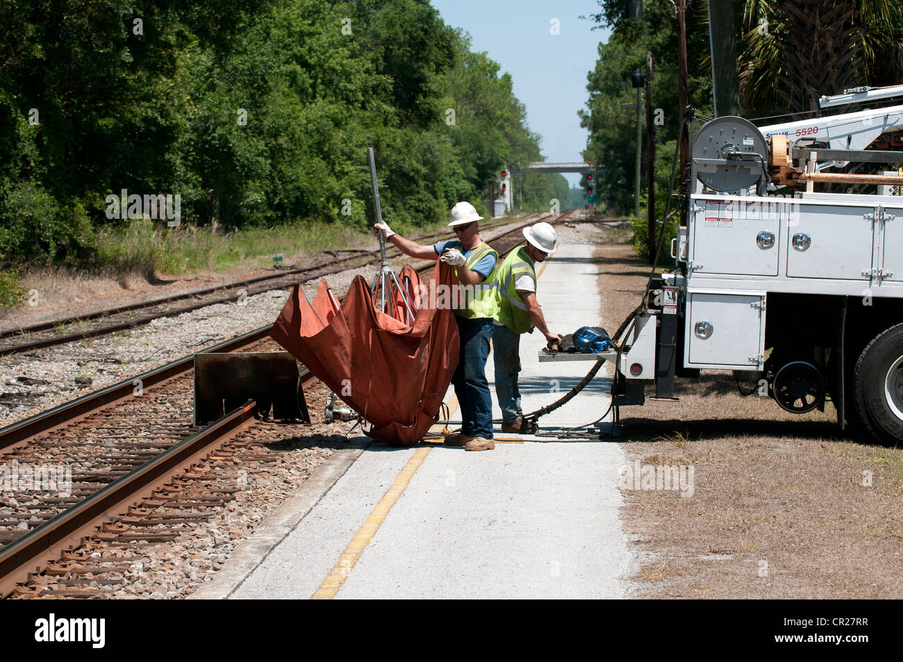 Permanent way engineers working on the railroad track close to DeLand