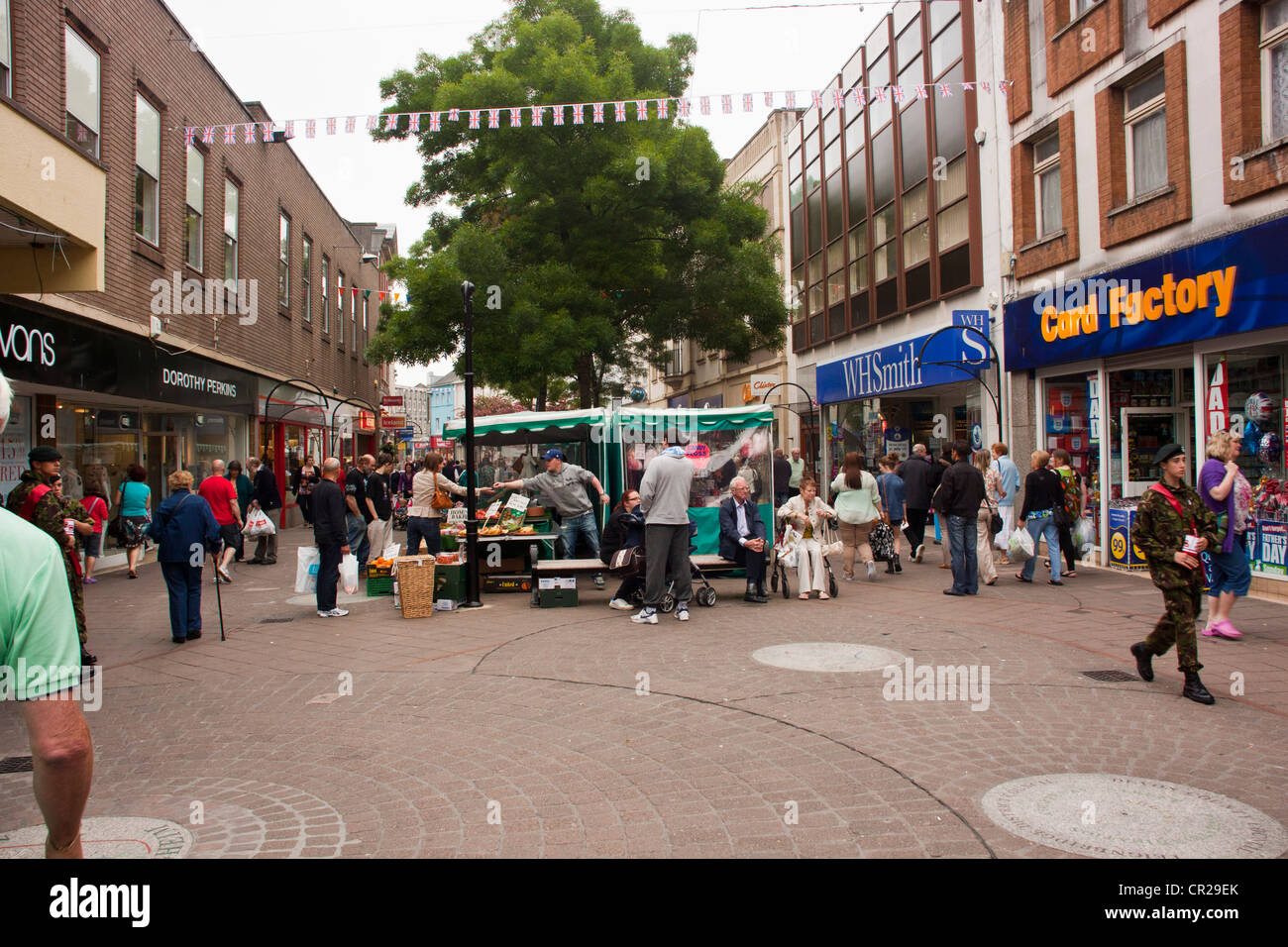 Market stalls in pedestrianized town center of Newton Abbot Devon UK. Stock Photo
