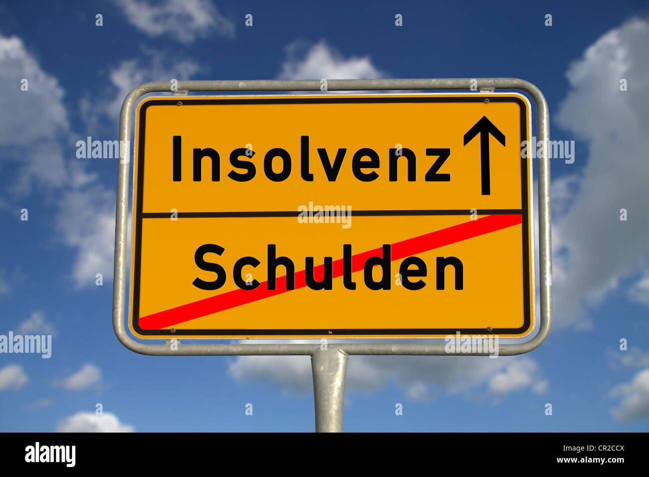 German road sign debt and bankruptcy with blue sky and white clouds Stock Photo