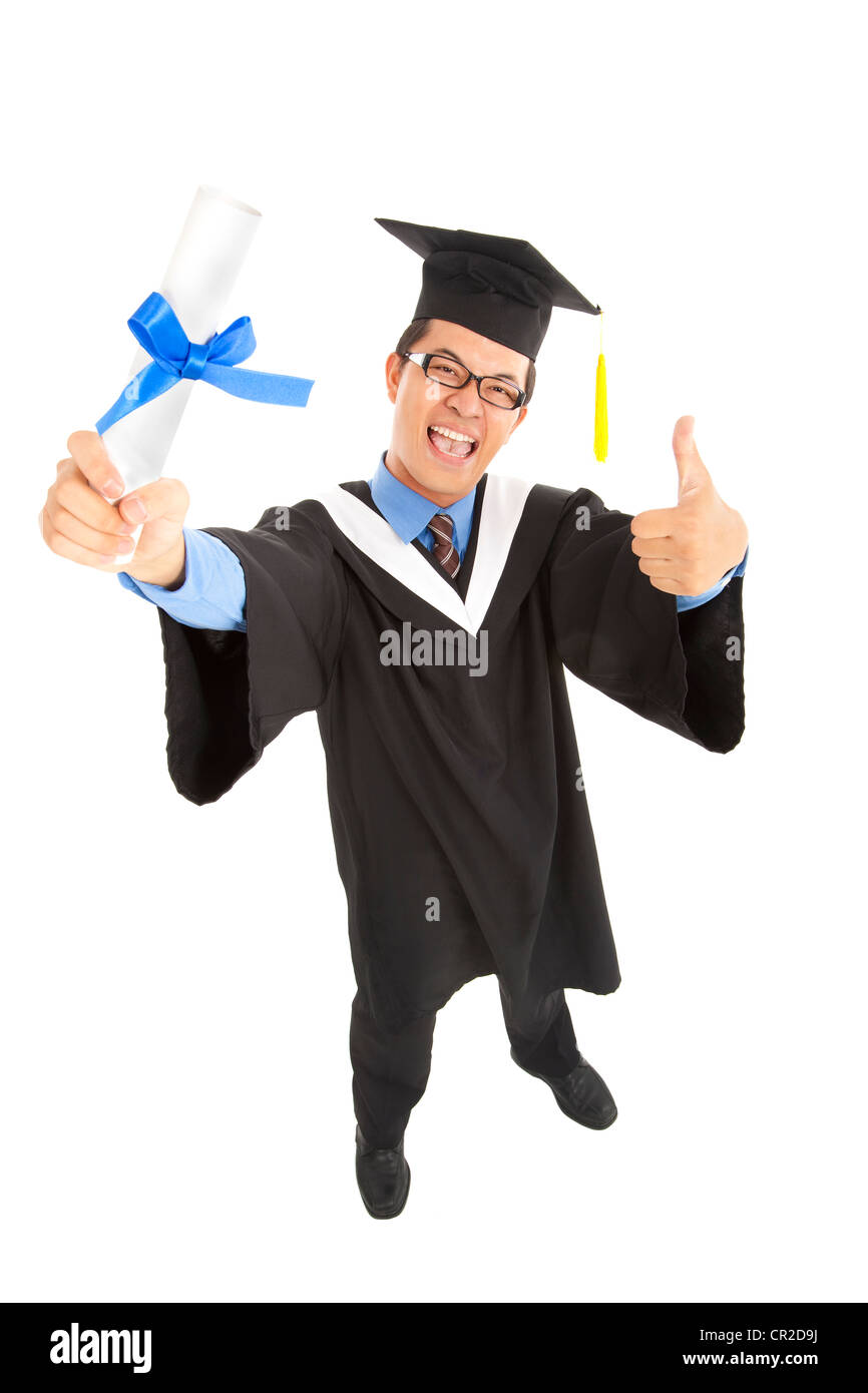 happy graduating student holding diploma with thumbs up Stock Photo