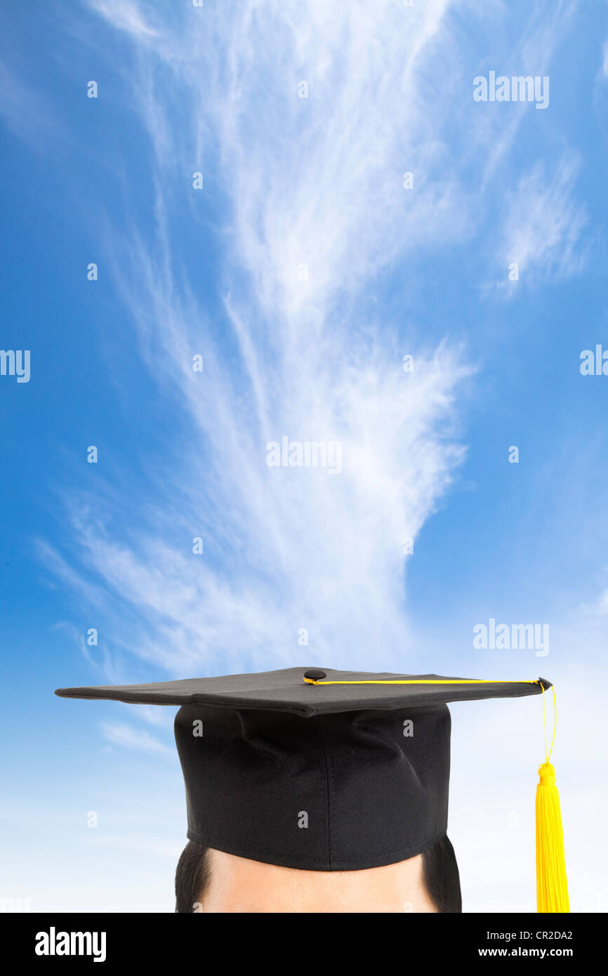 graduation cap and thinking concept with cloud background Stock Photo