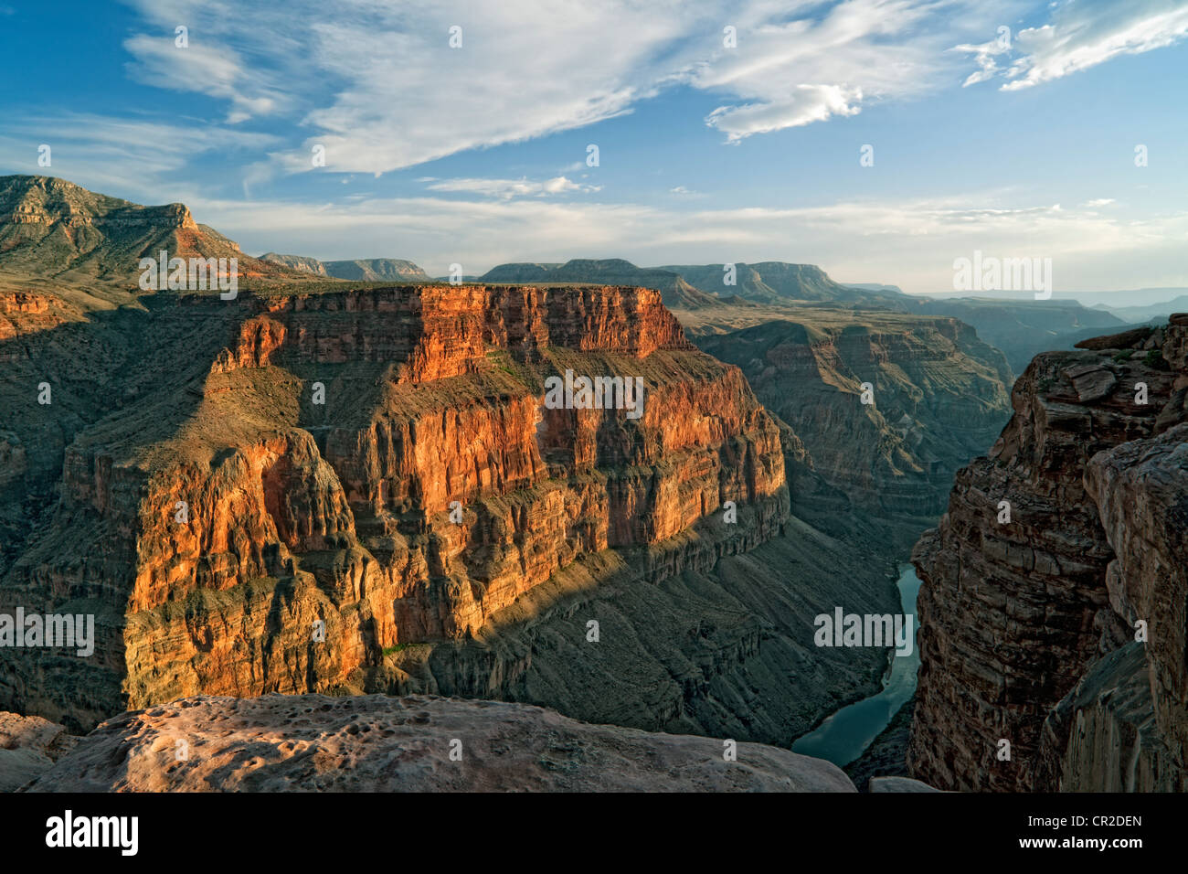 Evening light bathes the walls of Arizona’s Grand Canyon National Park from Toroweap with the Colorado River 3,000 feet below. Stock Photo