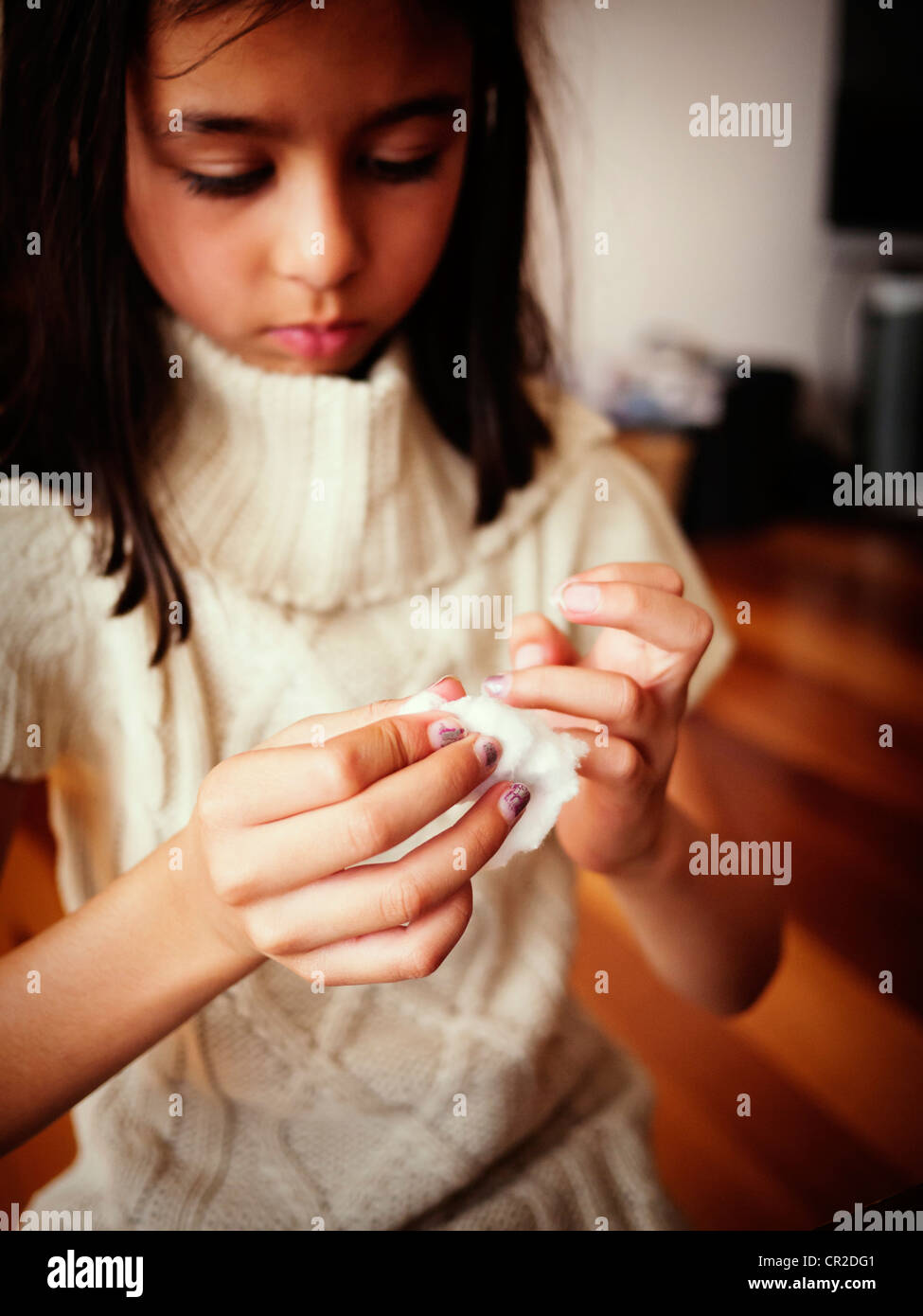 Girl removes nail polish Stock Photo