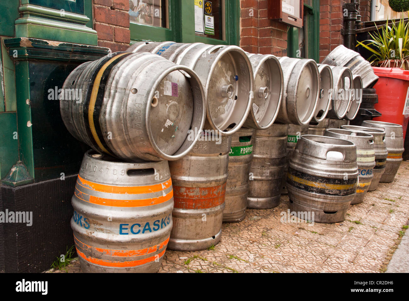 Aluminum beer barrels kegs outside the dolphin inn Dartmouth waiting to be collected by the dray men. Stock Photo