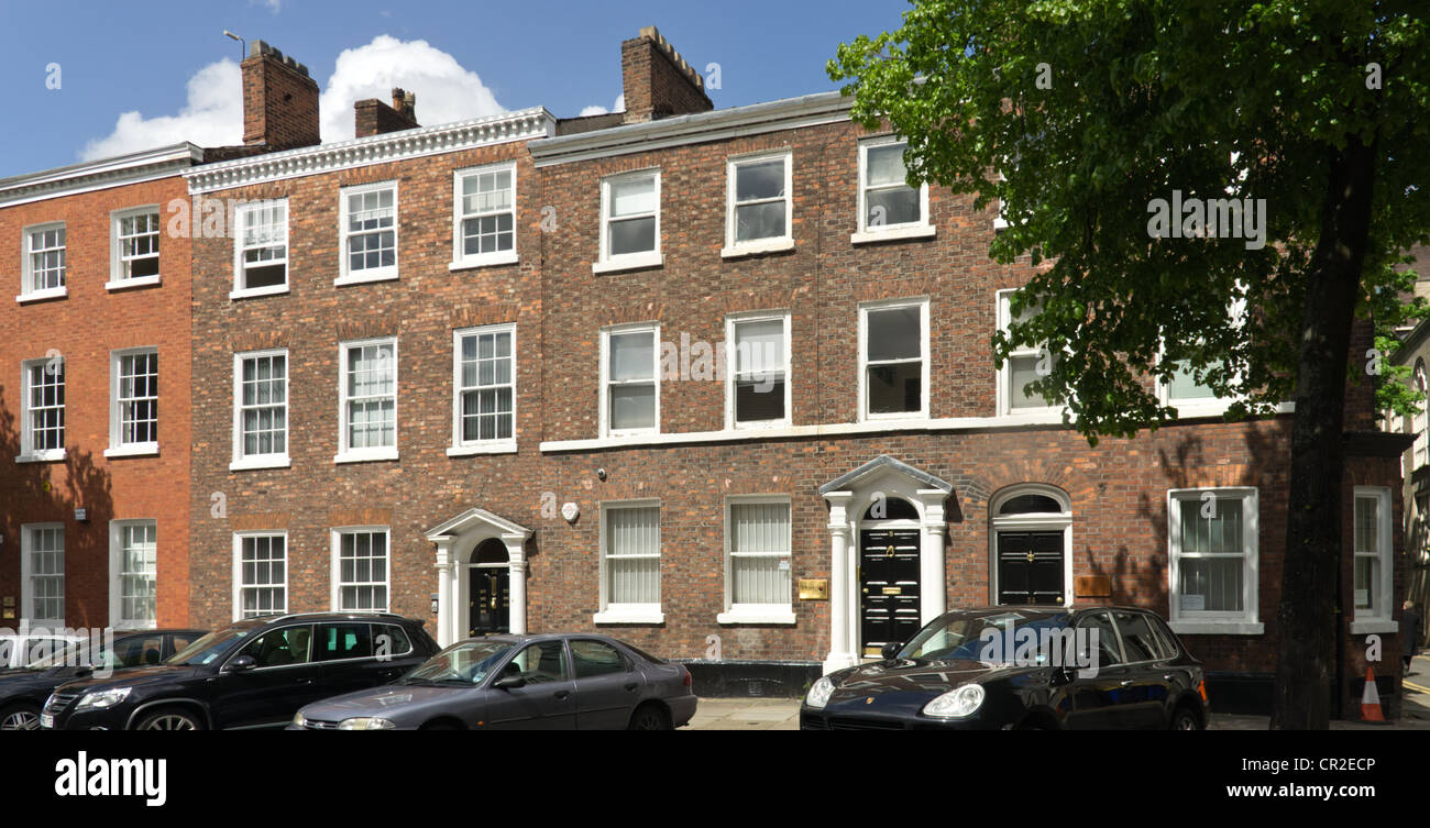 A view of St. John Street Manchester showing a building with red brick