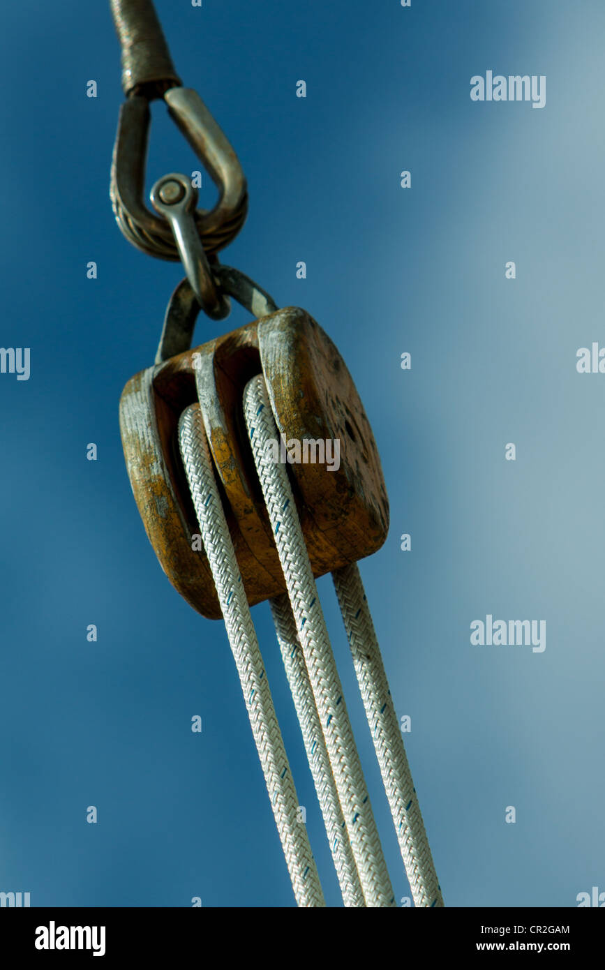wooden pulley on boat, rope of sail on a boat Stock Photo