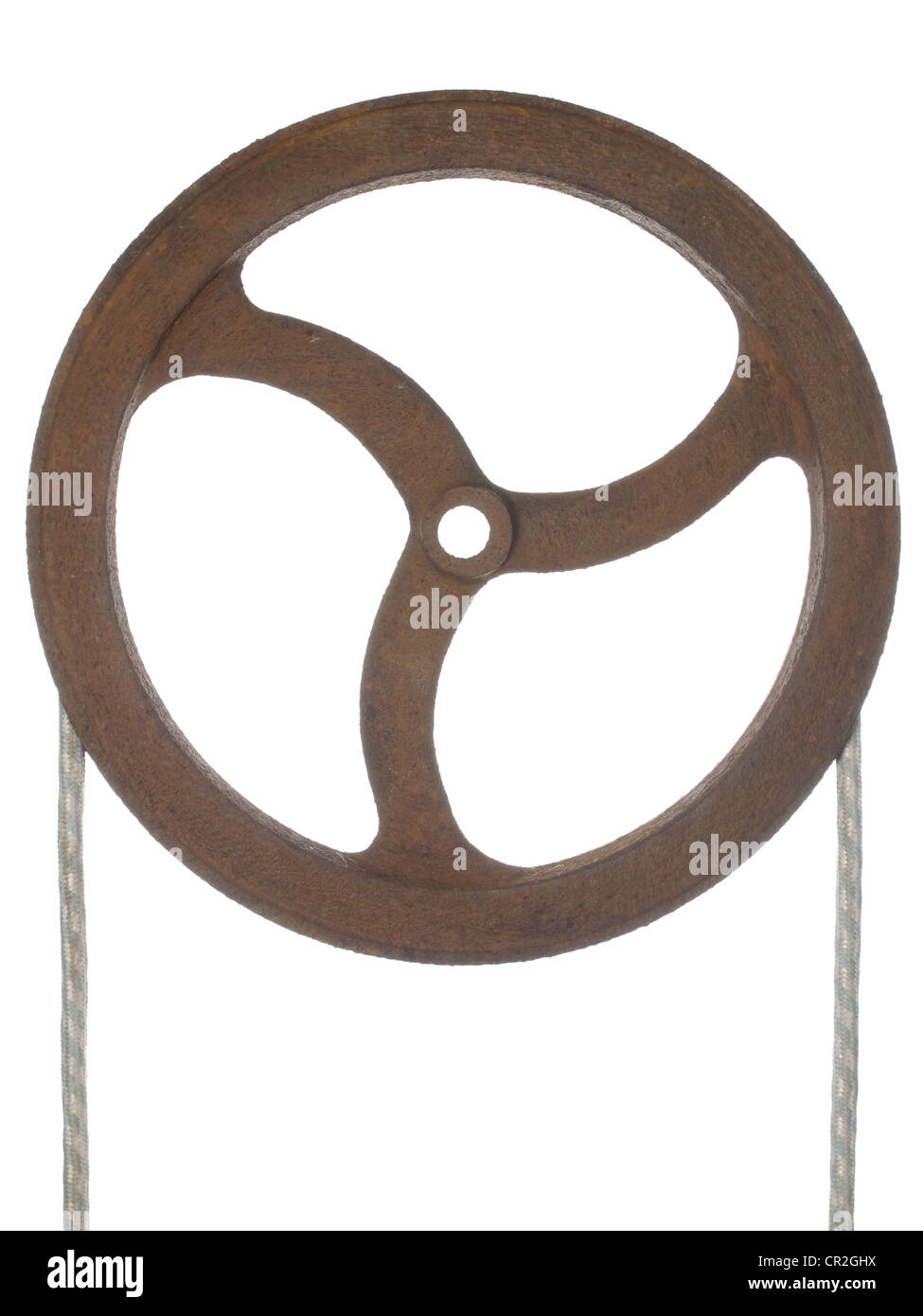 Old rusty pulley with a rope thrown, isolated on white. Stock Photo