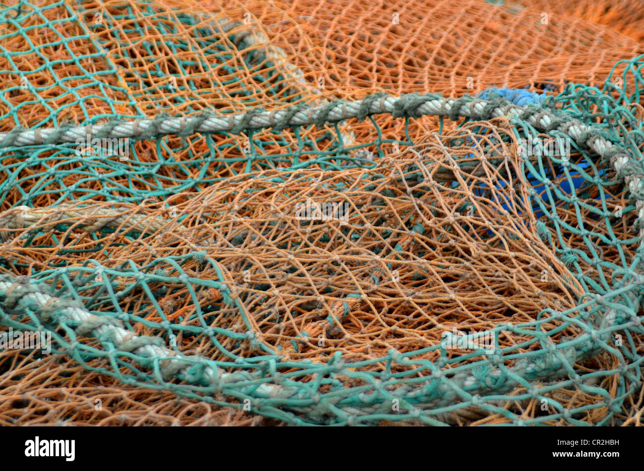 repaired fishing nets in different colors Stock Photo Alamy