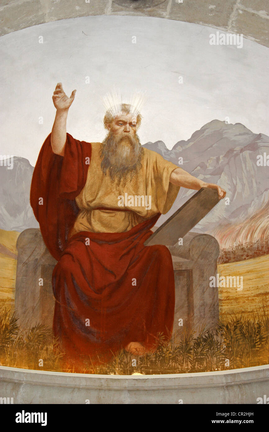 Painting of moses holding the ten commandments Stock Photo