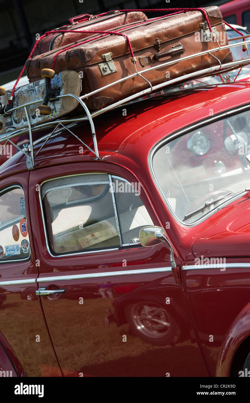 VW Volkswagen beetle car with suitcases and skateboard in the roof rack Stock Photo