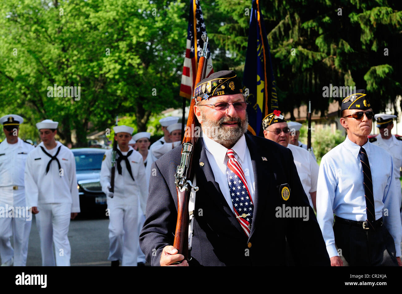 US Veterans of foreign wars marching in small town USA Memorial Day