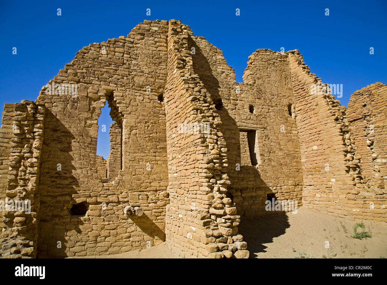 The sandstone walls of the Anasazi great house of Kin Kletso, in Chaco ...