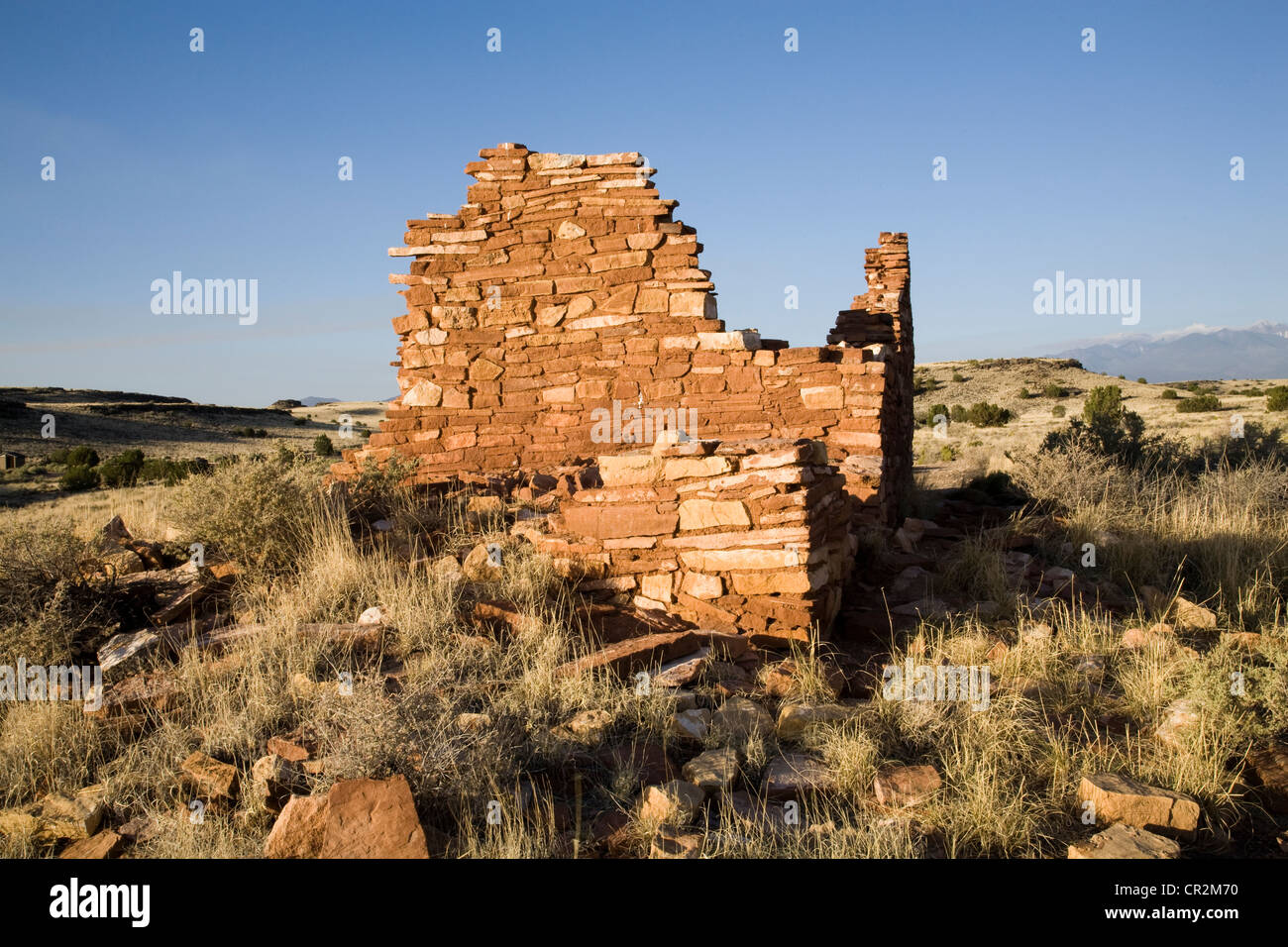 The sandstone walls of Box Canyon pueblo at Lomaki Ruins in Wupatki National Park, Arizona, just below the San Francisco Peaks. Stock Photo