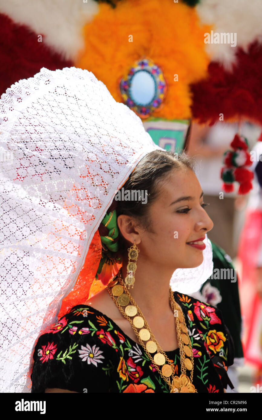 Mexican lady at festival with white lace headdress and traditional costume taken in Oaxaca city, Mexico Stock Photo